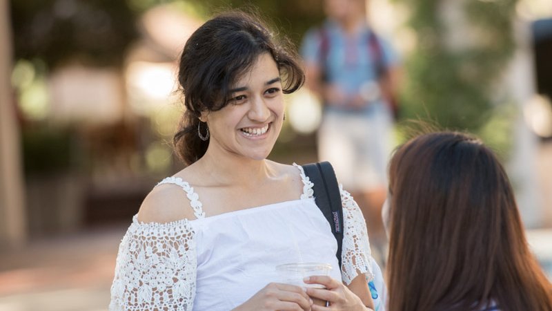Two Caltech students chat on campus